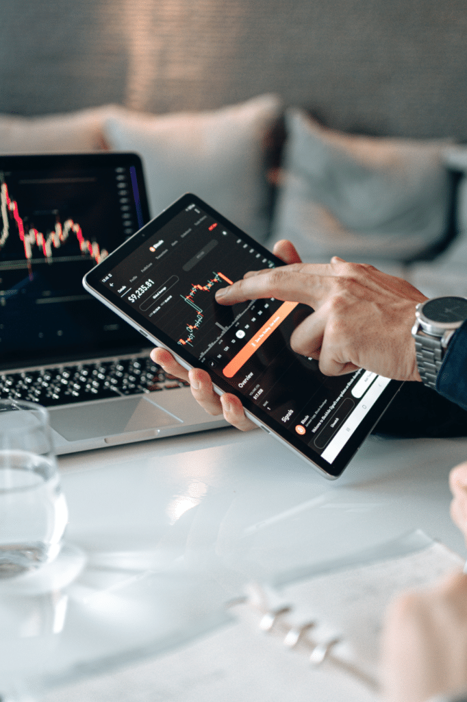Financial advisor reviewing data on tablet - VoIP and communication systems for financial institutio