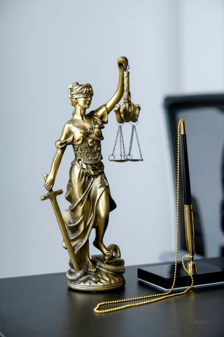 Lady Justice statue on law firm desk - VoIP and communication systems for legal practices